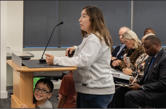 Tarrant County parent Jeanette Favela addresses the board with her sons Rafael and Roman, asking them to reconsider closing the Children’s Center. 